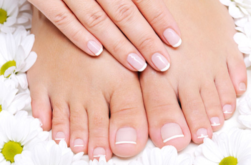 Stylish Lisa Nails & Spa Salon Services - Pure and Beauty female feet.